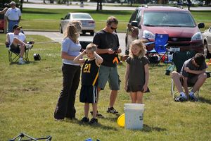 a family prepping a rocket